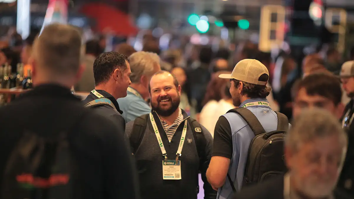 Attendees standing and talking at the GCSAA Conference and Trade Show Closing Reception